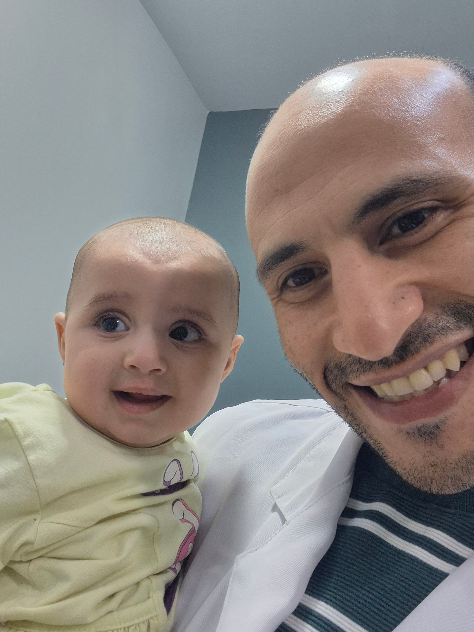 Maryam with Dr Ahmed Salah 4 months after cleft lip repair